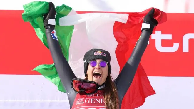 Winner Sofia Goggia of Italy celebrates on the podium after the Women's Downhill race at the FIS Alpine Skiing World Cup in Cortina d'Ampezzo, Italy, 20 January 2023. ANSA/ANDREA SOLERO