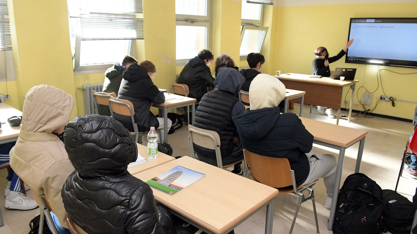 Studenti in classe col piumino