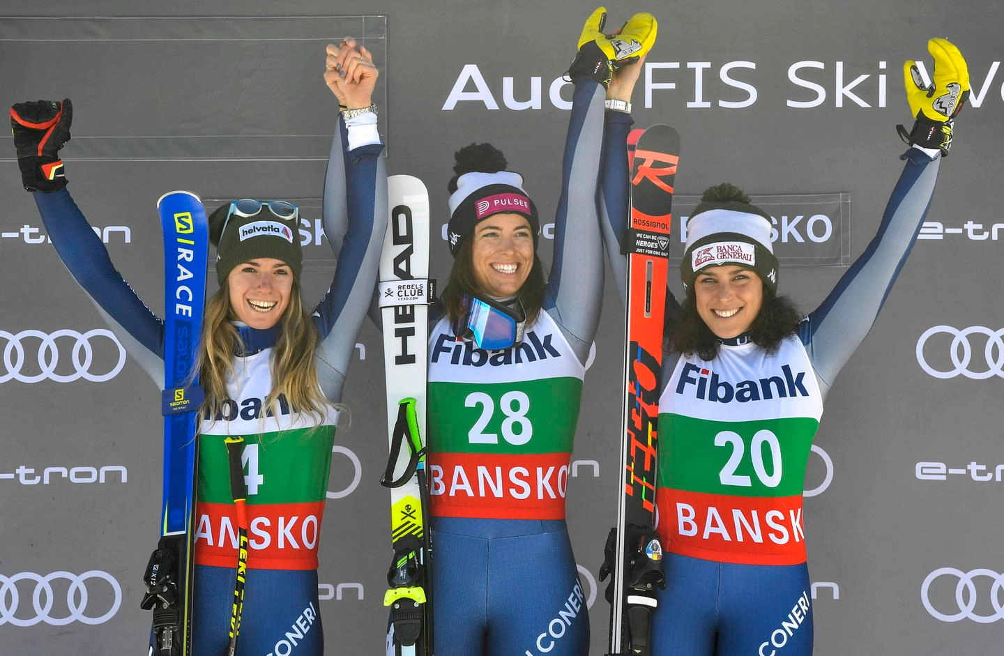 epa08162758 First placed Elena Curtoni (C), second placed Marta Bassino (L) and third placed Frederica Brignone (R) of Italy celebrate on the podium for the Women's Downhill race at the FIS Alpine Skiing World Cup in Bansko, Bulgaria on 25 January 2020.  EPA/GEORGI LICOVSKI