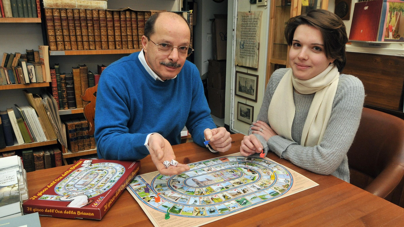 Storia e curiosità dei giochi in scatola comaschi. E con le carte si riscoprono alborella e Lariosauro