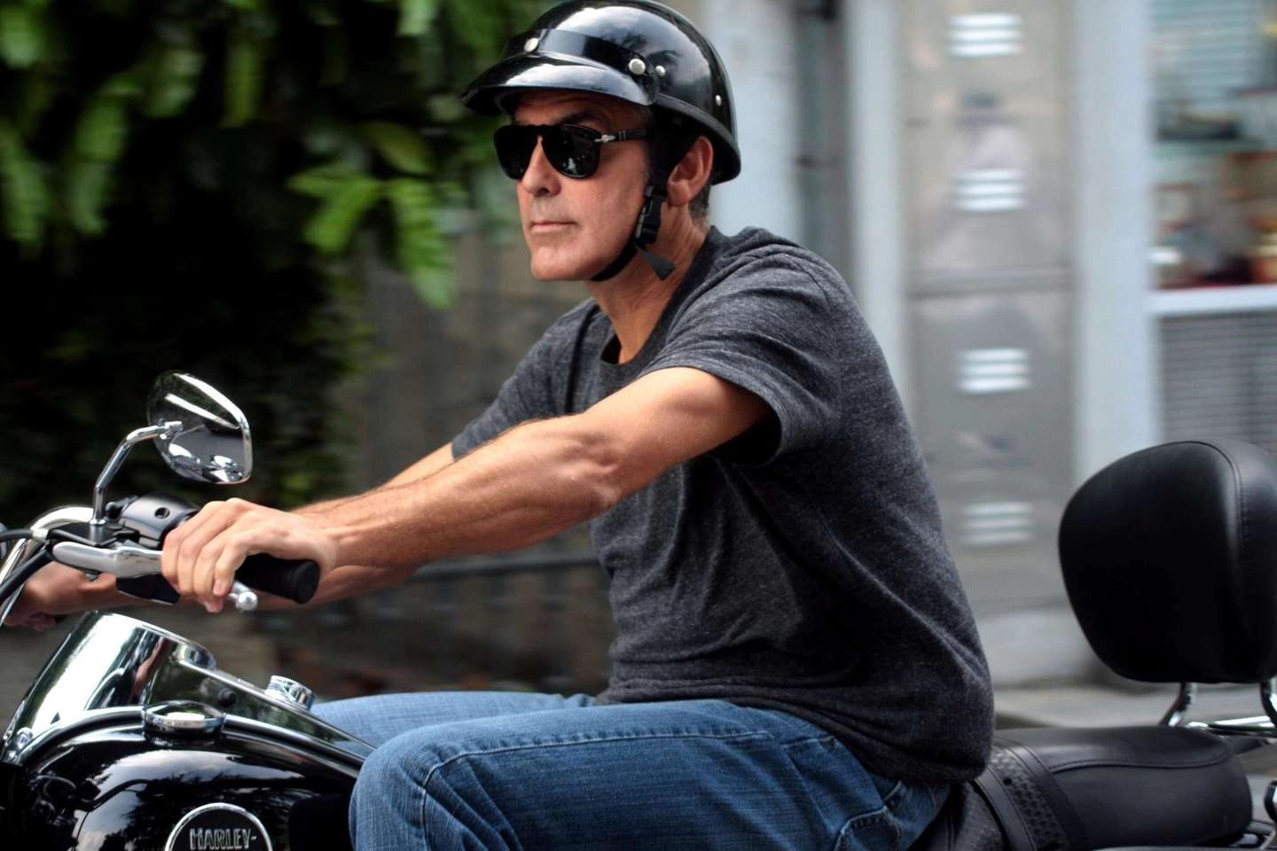 George Clooney on his motorcycle on the roads of Lario