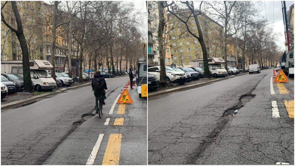 Una ciclista nei pressi della buca di viale Umbria all'altezza del civico 101