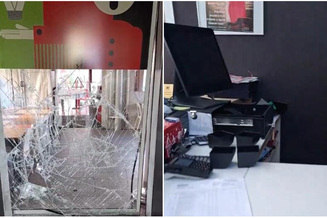 La vetrata distrutta nel ristorante Pizzaut di Cassina de' Pecchi; a lato il registratore di cassa svuotato (dal video Facebook)