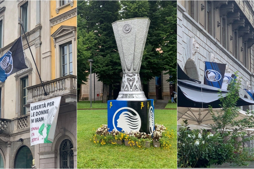Bergamo festeggia l'Atalanta: bandiera della Dea in Comune, coppa sull'aiuola del Sentierone e addobbi nerazzurri in città