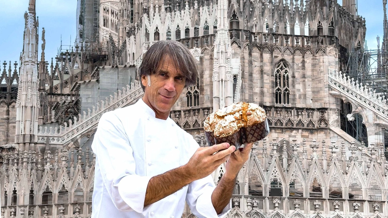 Davide Oldani con la sua colomba D'Om realizzata per il Duomo di Milano, che si staglia sullo sfondo Davide Oldani con la sua colomba D'Om realizzata per il Duomo di Milano, che si staglia sullo sfondo