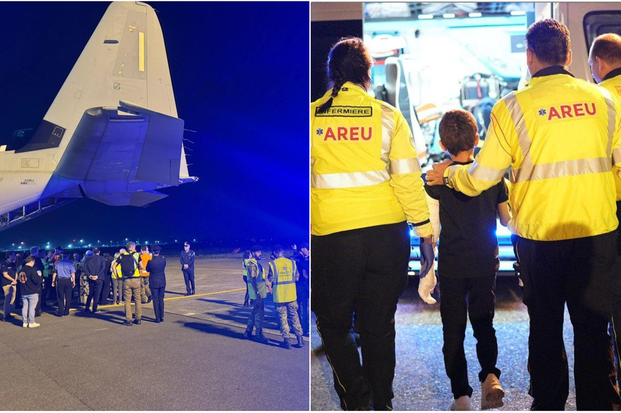 L'aereo atterrato a Linate; di spalle, il piccolo Adam accompagnato dagli operatori Areu
