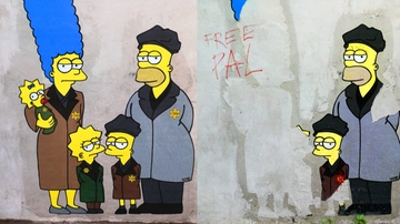 Milano, vandalizzato di nuovo il murale di Palombo dedicato alla Shoah: la scritta “Free Pal” e vernice rossa sulla stella di Davide