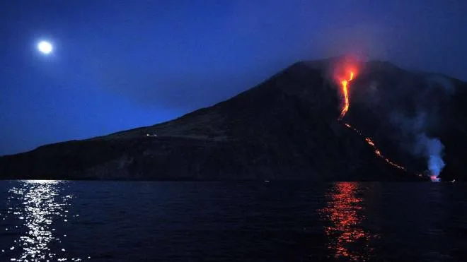 Lava from the Stromboli volcano flows into the sea, on August 9, 2014. Stromboli, one of Europe's most active volcanoes, is part of the seven-island Eolian Archipelago just off Sicily in southern Italy. AFP PHOTO/GIOVANNI ISOLINO