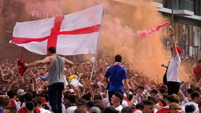 England fans cheer on their team outside Wembley Stadium ahead of the UEFA EURO 2020 final football match between England and Italy in northwest London on July 11, 2021. (Photo by Niklas HALLE'N / AFP)