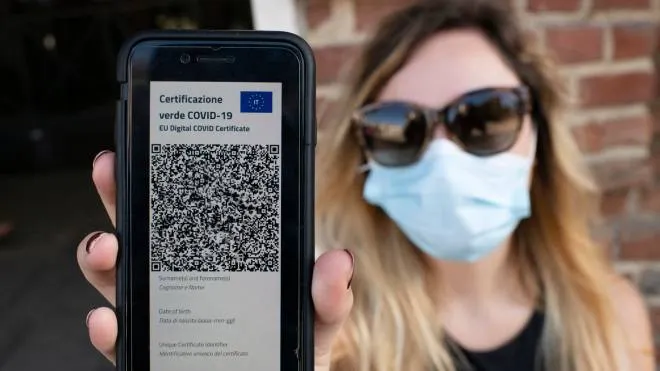 TURIN, ITALY - JUNE 30: A woman shows Italy's Covid-19 Green Pass for post-vaccine travel on a smartphone on June 30, 2021 in Turin, Italy. The digital health certificate, or Green Pass, was officially launched by Italian Prime Minister Draghi, allowing people to access certain events and facilities in Italy as well as travel domestically and abroad. (Photo by Stefano Guidi/Getty Images)