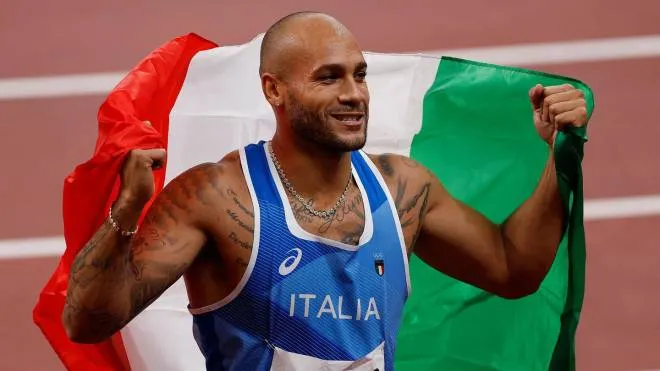 Italy's Lamont Marcell Jacobs celebrates after winning the men's 100m final during the Tokyo 2020 Olympic Games at the Olympic Stadium in Tokyo on August 1, 2021. (Photo by Odd ANDERSEN / AFP)
