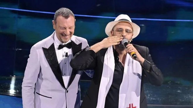 Sanremo Festival host and artistic director, Amadeus (L), and Italian actor Checco Zalone on stage at the Ariston theatre during the 72nd Sanremo Italian Song Festival, Sanremo, Italy, 02 February 2022. The music festival runs from 01 to 05 February 2022.  ANSA/RICCARDO ANTIMIANI