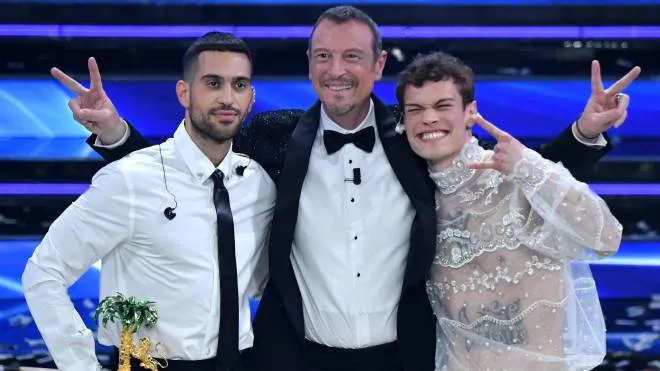 Sanremo Festival host and artistic director, Amadeus (C) with Italian singers Blanco & Mahmoodon pose on stage at the Ariston theatre with the prize after winning the 72nd Sanremo Italian Song Festival, in Sanremo, Italy, 05 February 2022. The music festival runs from 01 to 05 February 2022.   ANSA/ETTORE FERRARI