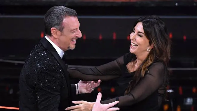 Sanremo Festival host and artistic director, Amadeus (L) and Italian actress Sabrina Ferilli (R) on stage at the Ariston theatre during the 72nd Sanremo Italian Song Festival, in Sanremo, Italy, 05 February 2022. The music festival runs from 01 to 05 February 2022.   ANSA/ETTORE FERRARI