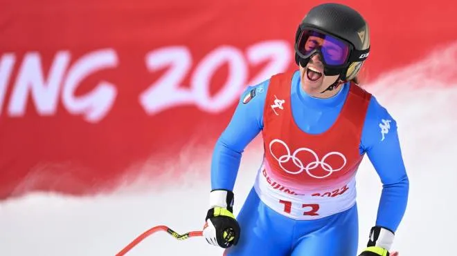 epa09757462 Sofia Goggia of Italy reacts in the finish area during the Women's Downhill race of the Alpine Skiing events of the Beijing 2022 Olympic Games at the Yanqing National Alpine Ski Centre Skiing, Beijing municipality, China, 15 February 2022.  EPA/JEAN-CHRISTOPHE BOTT