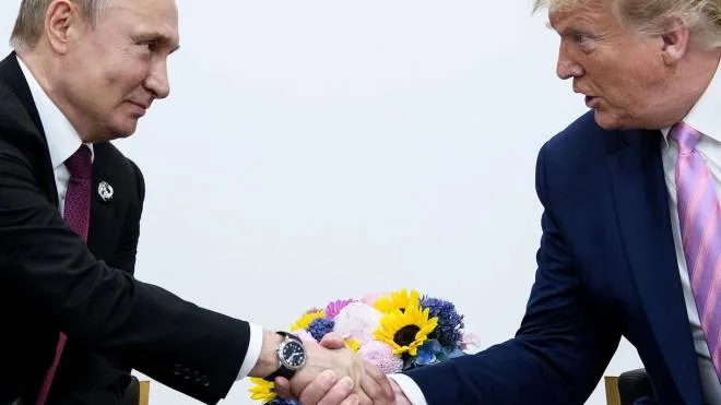 (FILES) In this file photo taken on June 28, 2019, US President Donald Trump (R) attends a meeting with Russia's President Vladimir Putin during the G20 summit in Osaka, Japan. - Former US president Donald Trump boasted of his close relationship with Russian leader Vladimir Putin on February 22, 2022, arguing that the Ukraine crisis would not have happened under his administration. (Photo by Brendan Smialowski / AFP)