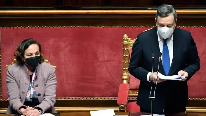 Italian premier Mario Draghi, flanked by Italian Interior Minister Luciana Lamorgese (L), speaks at the Senate on the Ukrainian crisis, in Rome, Italy,01 March 2022. ANSA/ETTORE FERRARI
