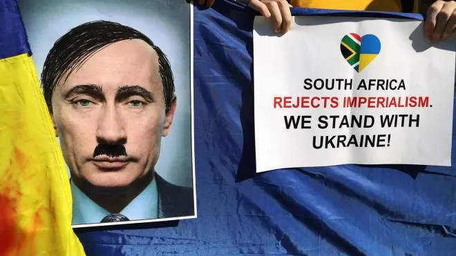 A member of South Africa's Ukrainian Association holds a poster depicting Russian President Vladimir Putin as Adolf Hitler during their protest in support of Ukraine in front of the Department of International Relations and Cooperation (DIRCO) in Pretoria, on March 1, 2022. - Ukraine is finding it hard to get its message across in southern Africa, where there remains affection for Moscow dating from the apartheid era, the Ukrainian ambassador in Pretoria said.
Like Ukrainian envoys around the world, Ambassador Liubov Abravitova is striving to rally support for her invaded country. (Photo by Phill Magakoe / AFP)