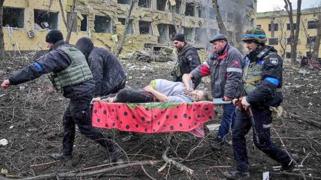 A pregnant woman is carried on a stretcher bed as she is evacuated from a children hospital in Mariupol, southeastern Ukraine, following Russia army bombardment on Wednesday March 9, 2022. The Ukraine Armed Forces who releases this photo does not indicate casualties of the strikes. Ukraine President Volodymyr Zelensky confirms the strike of the maternity hospital in Mariupol, saying in his online post: People, children are under the wreckage. Atrocity! How much longer will the world be an accomplice ignoring terror? Close the sky right now! Stop the killings! You have power but you seem to be losing humanity. The Red Cross say the humanitarian crisis in Mariupol is apocalyptic and worsening by the hour as Russia continues to bombard the besieged Ukrainian city. Mariupol is a city of regional significance in south eastern Ukraine, situated on the north coast of the Sea of Azov at the mouth of the Kalmius river, in the Pryazovia region. It is the tenth-largest city in Ukraine, and the second largest in Donetsk Oblast with a population of 431,859. (Ukraine Armed Forces/EYEPRESS) (Photo by EyePress News / EyePress via AFP)