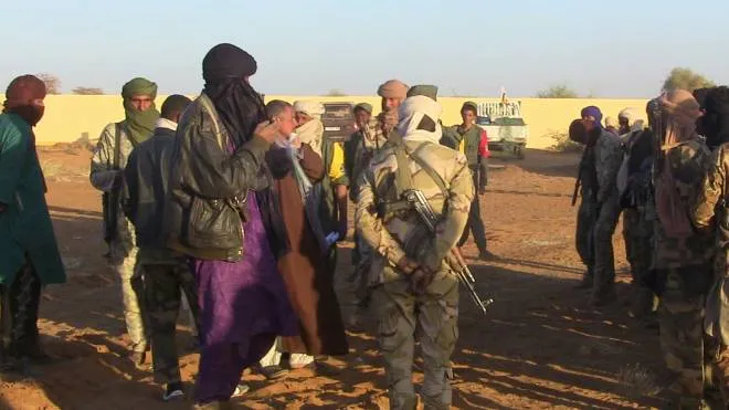 A photo taken on January 9, 2017 shows former rebels, predominantly Tuareg, waiting in a regroupment camp in Gao, before participating in joint patrols with the Malian army and pro-government militias. - Former Tuareg rebels on January 5 entered Gao, the main city in northern Mali, to begin joint patrols with government troops, a key part of a peace accord for the troubled region. (Photo by AFP)