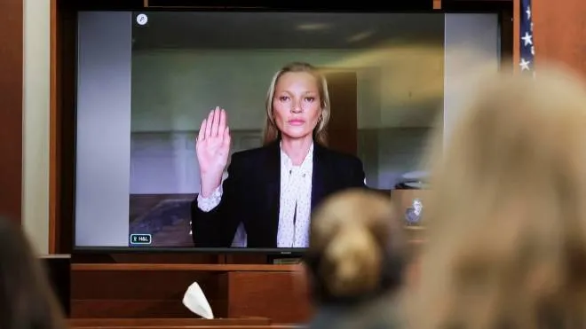 epa09974649 Model Kate Moss, a former girlfriend of actor Johnny Depp, is sworn in to testify via video link during Depp's defamation trial against his ex-wife Amber Heard, at the Fairfax County Circuit Courthouse in Fairfax, Virginia, USA, 25 May 2022. Johnny Depp's 50 million US dollar defamation lawsuit against Amber Heard started on 10 April.  EPA/EVELYN HOCKSTEIN / POOL