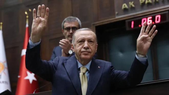 Turkish President and leader of the Justice and Development Party (AK Party) Recep Tayyip Erdogan waves as he attends his party�s parliamentary group meeting at the Turkish Grand National Assembly in Ankara on June 1, 2022. (Photo by Adem ALTAN / AFP)