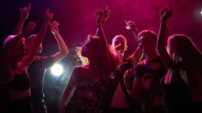 Group of teenagers having fun at nightclub