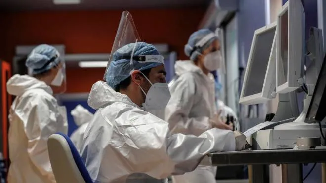 Health workers wearing overalls and protective masks in the intensive care unit of the Covid intensive care unit of the GVM ICC hospital of Casal Palocco near Rome, Italy, 21 January 2022. ANSA/GIUSEPPE LAMI