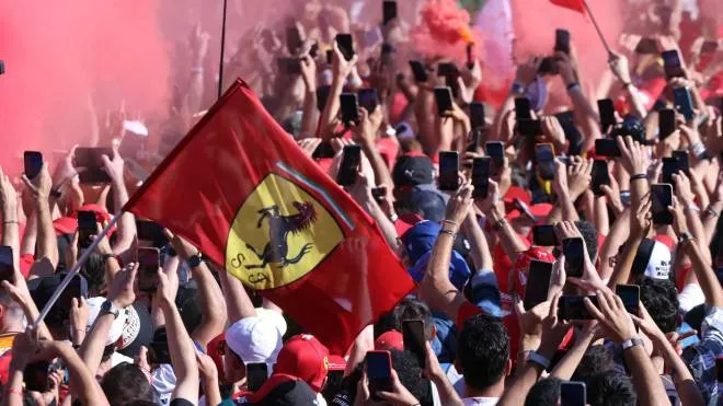 Ferrari�s supporters take picture of the podium  at  the Formula One Grand Prix of Italy at the Autodromo Nazionale Monza race track in Monza, Italy, 11.  
ANSA / MATTEO BAZZI