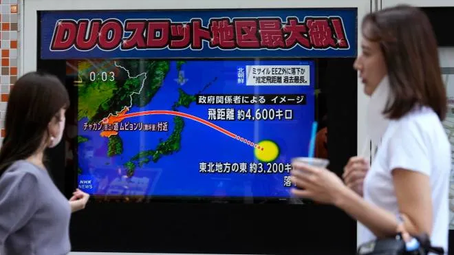 epa10222098 A Pedestrian watches a screen displaying news reporting of North Korea's launch of a ballistic missile in Tokyo, Japan, 04 October 2022. North Korea launched a ballistic missile over Japan that landed in the Pacific Ocean, the exclusive economic zone (EEZ) of Japan, about 3000km east of Japan. Japan issued the warning J-Alert to citizens after the missile launch. The display shows the vector of the North Korean missile from North Korea to the EZZ in the Pacific Ocean. Guam is shown at center bottom.  EPA/KIMIMASA MAYAMA