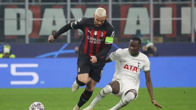 AC Milan's defender Theo Hernandez in action against Tottenham Hotspur's midfielder Pape Sarr during the 1st leg of the UEFA Champions League round of 16 soccer match between AC Milan and Tottenham Hotspurs at Giuseppe Meazza Stadium in Milan, Italy, 14 Februray 2023. ANSA / ROBERTO BREGANI